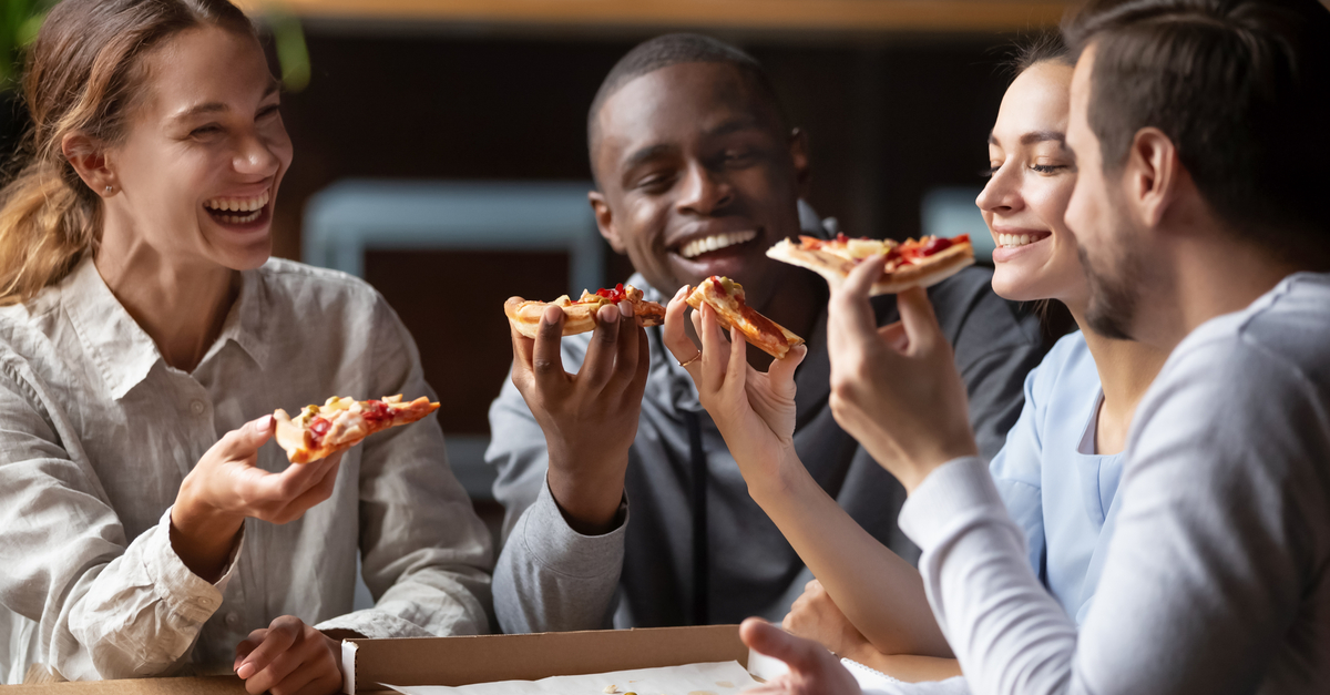 Business meeting eating pizza